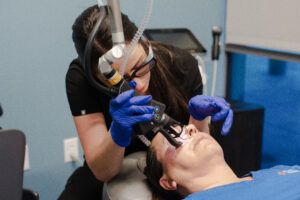 Nurse with CoolPeel Laser on patient